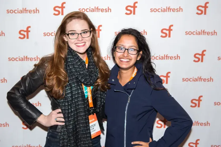 Two attendees at the step-and-repeat, 2016